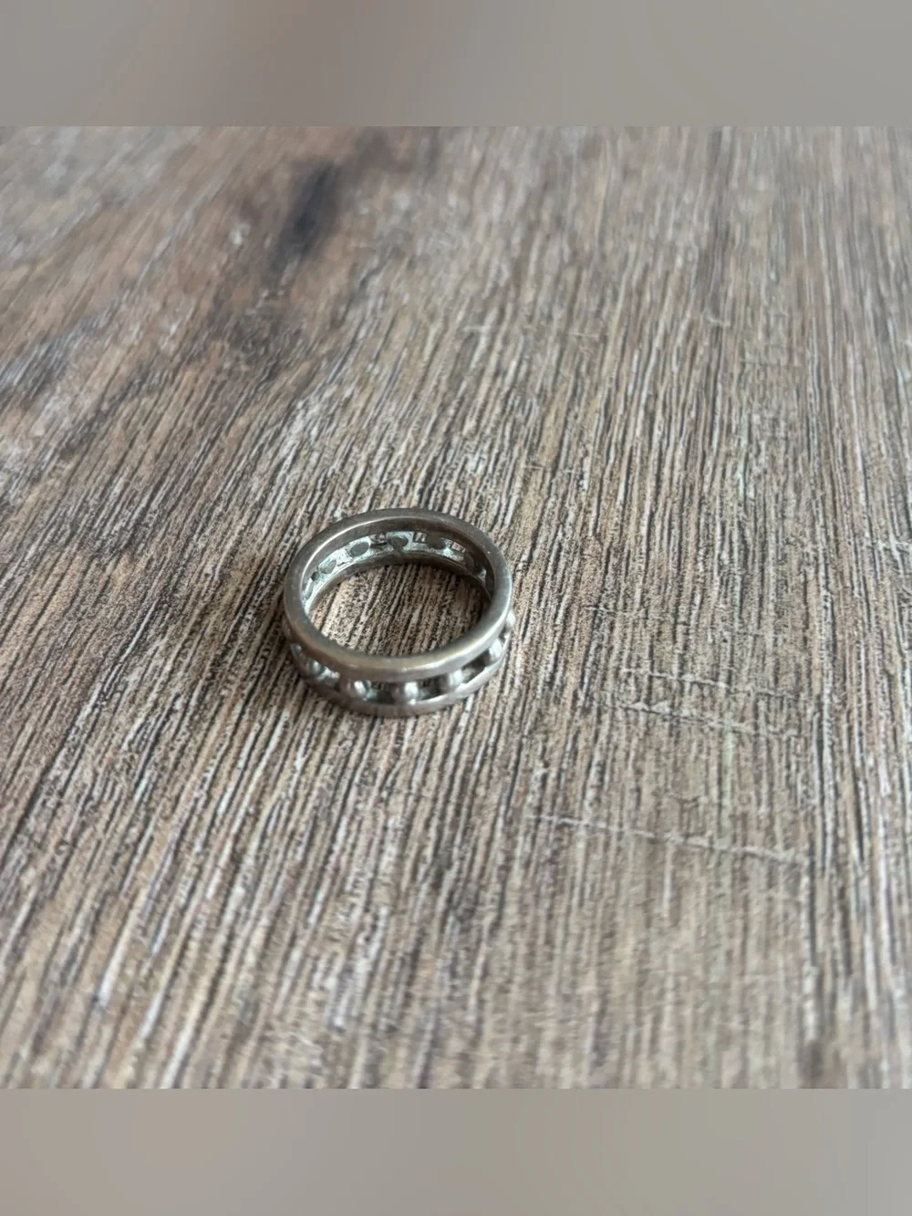 Women’s size 11.5 silver-toned metal ball bearing or studded channel band ring